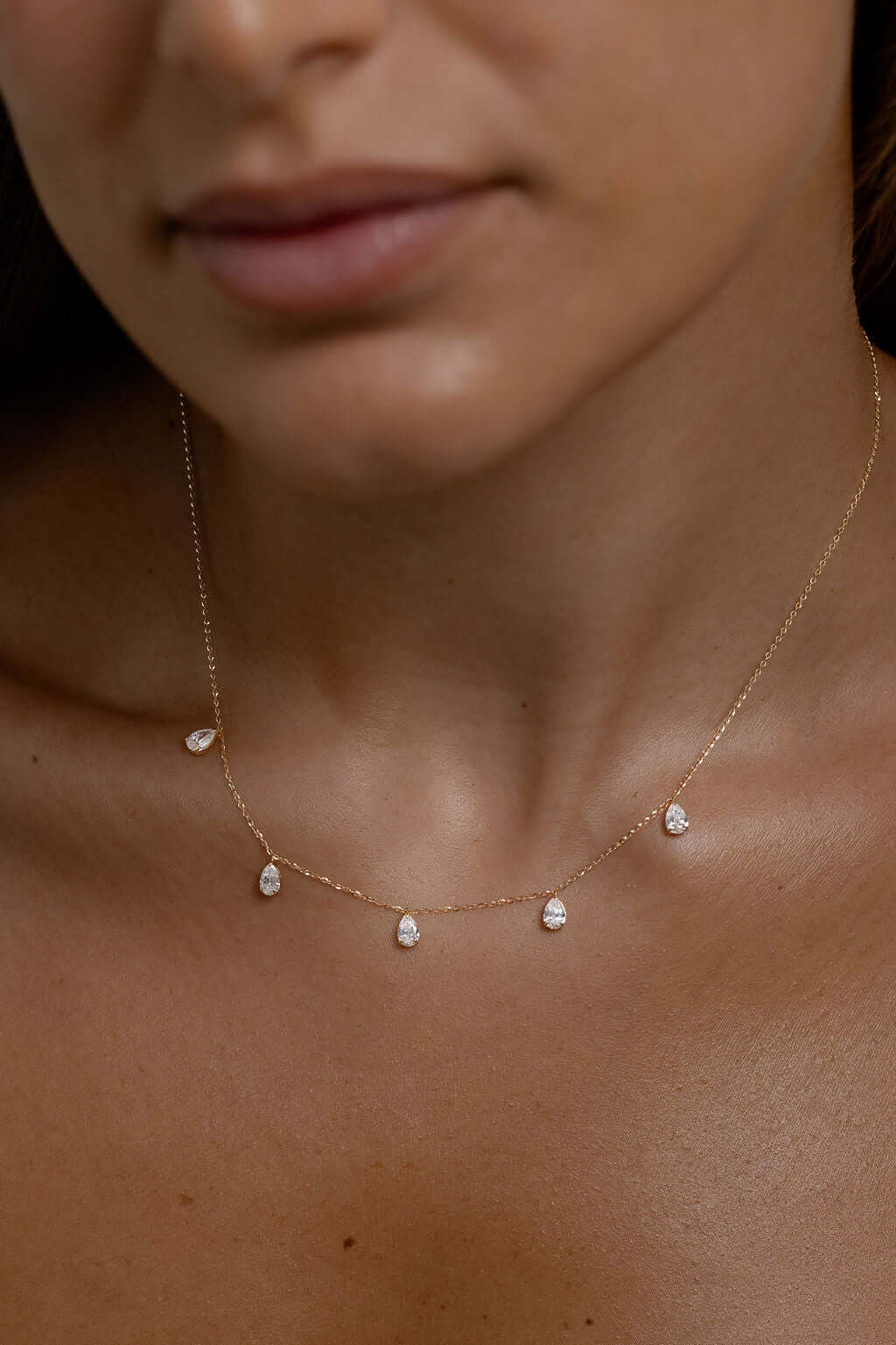 Hanging Pear Diamond Station Necklace 1.4ct Lab Diamond displayed elegantly on a model's neck.