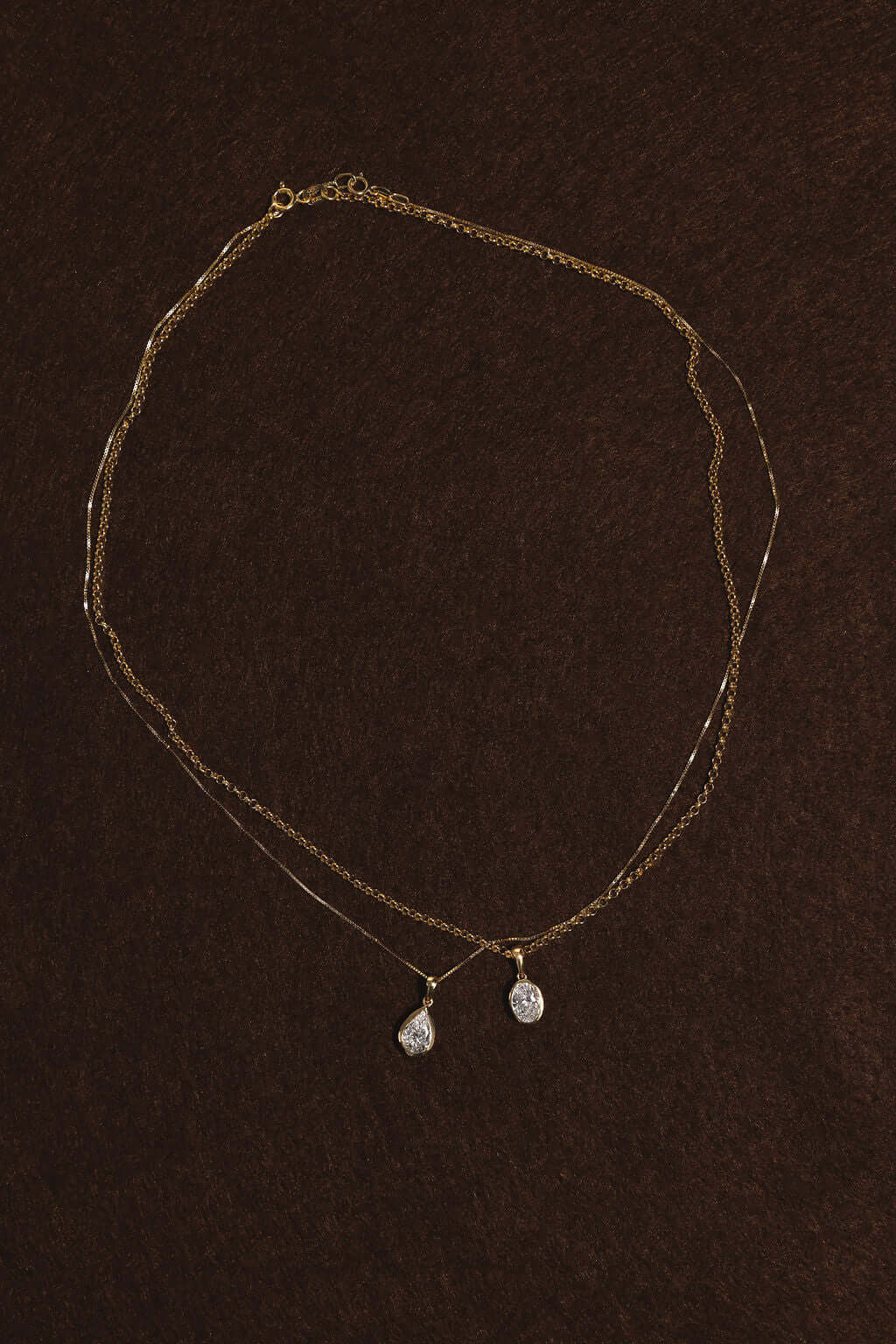 1ct Oval Lab Diamond Bezel Pendant in yellow gold, showcasing a beautiful diamond design.