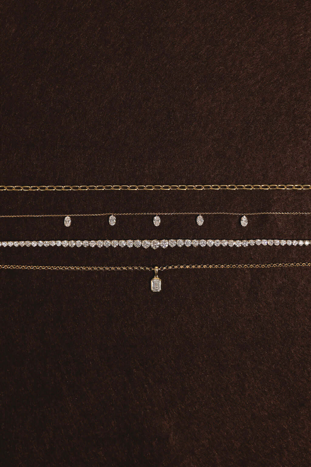 Hanging Oval Diamond Station Necklace 1.6ct Lab Diamond displayed on a dark background with multiple chains.