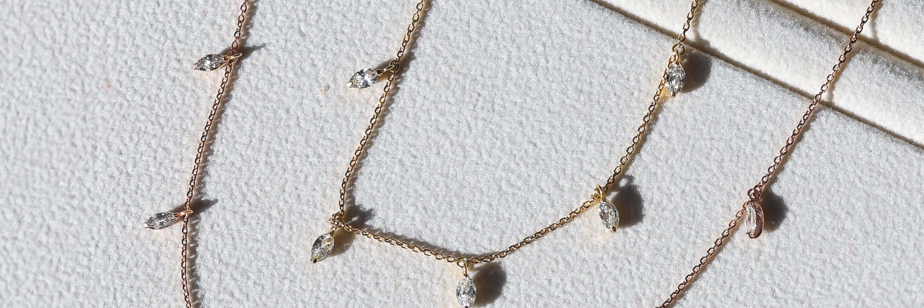 stacking diamond droplet necklaces