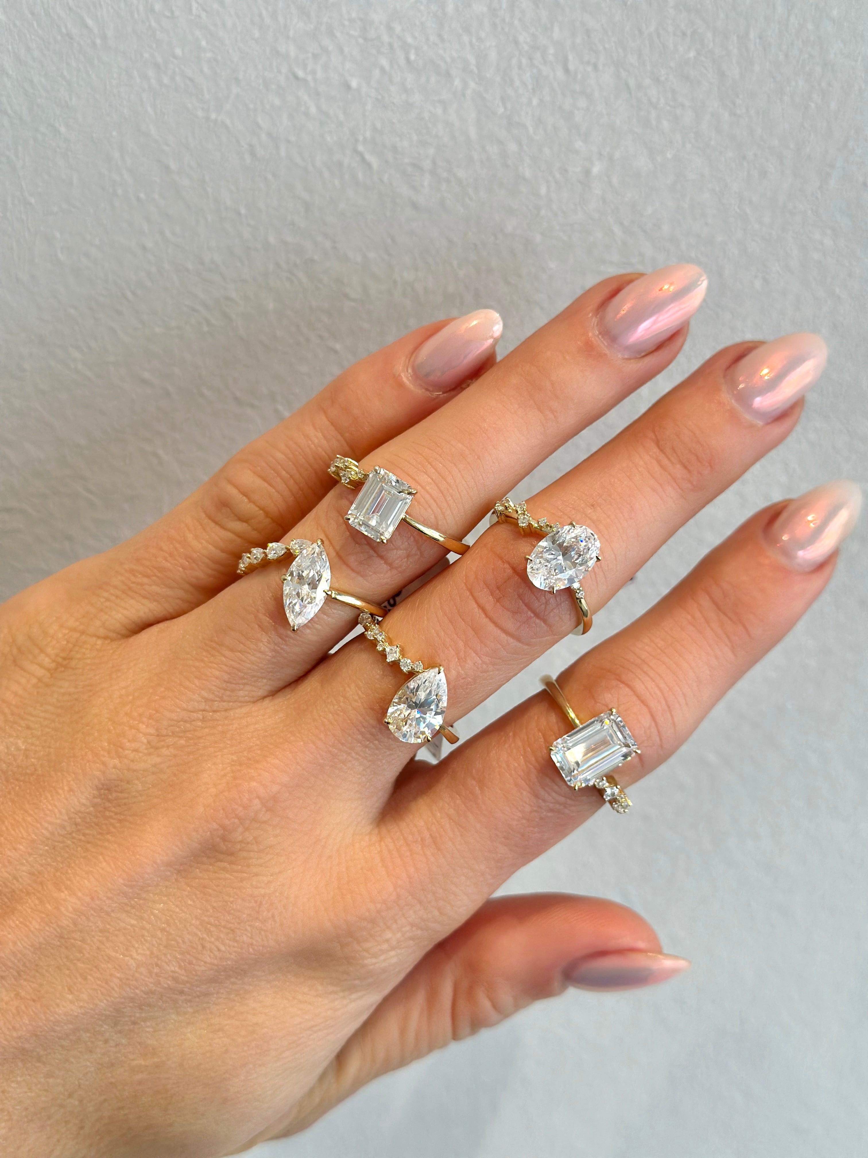 multiple diamond rings on hand