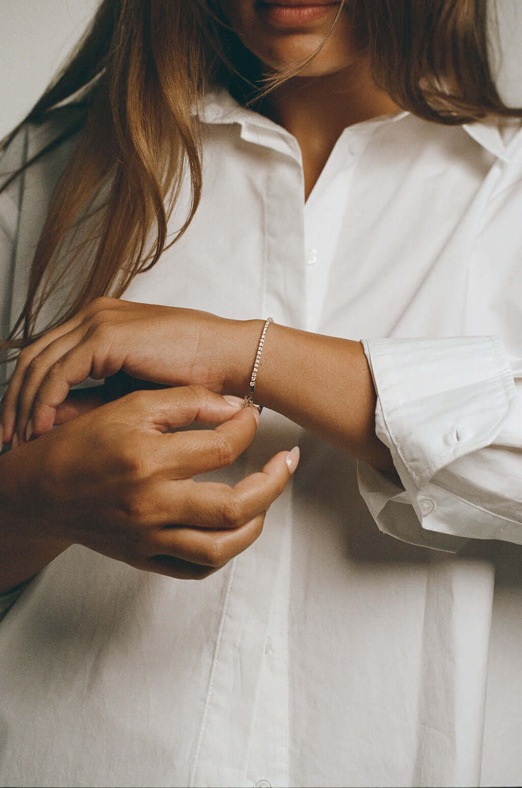 Classic Round tennis Bracelet 2ct Lab Diamond being worn by a woman in a white shirt.
