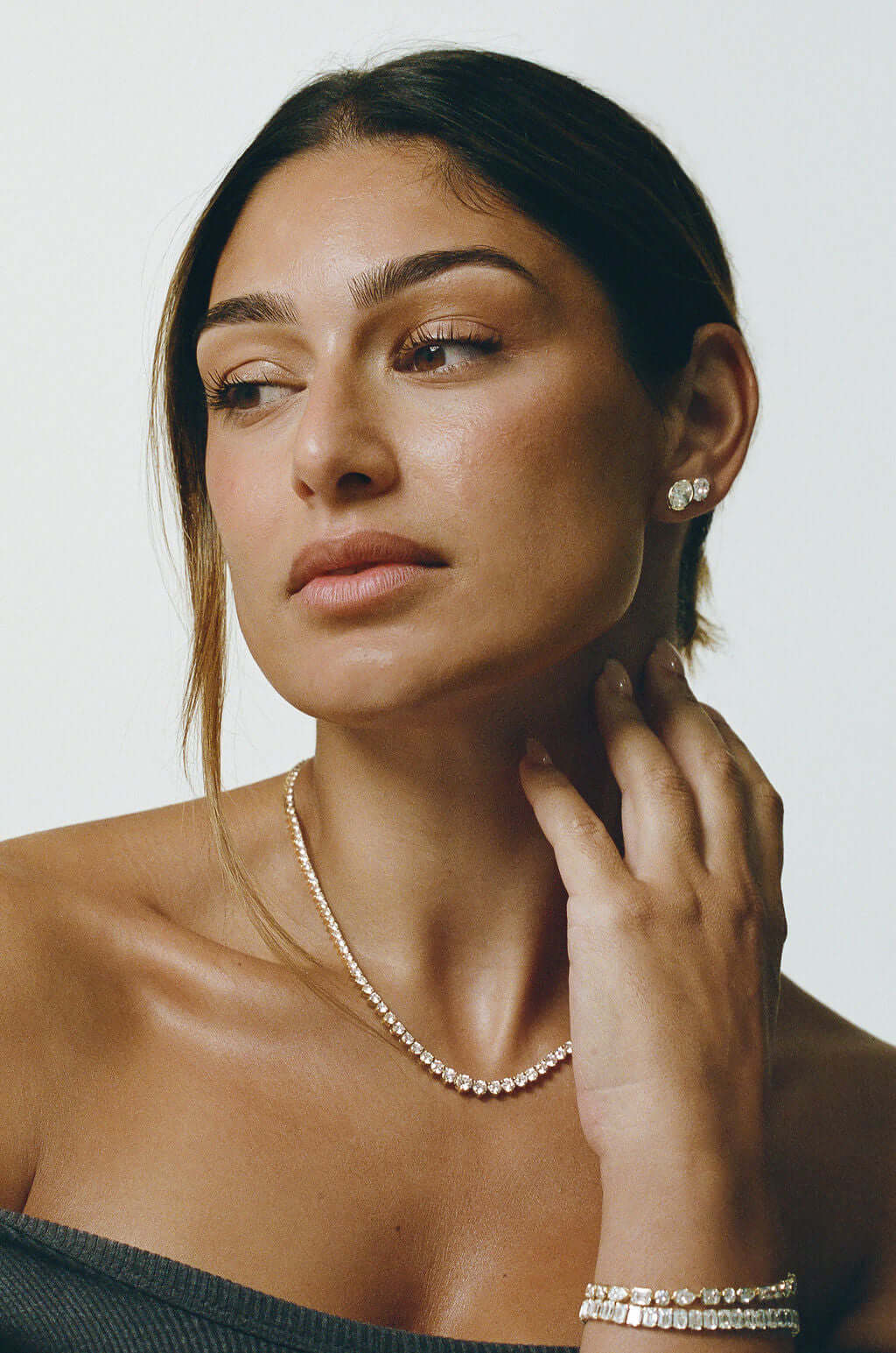 Graduated Riviera Diamond Necklace 14.6ct Lab Diamond worn elegantly with matching earrings and bracelet.