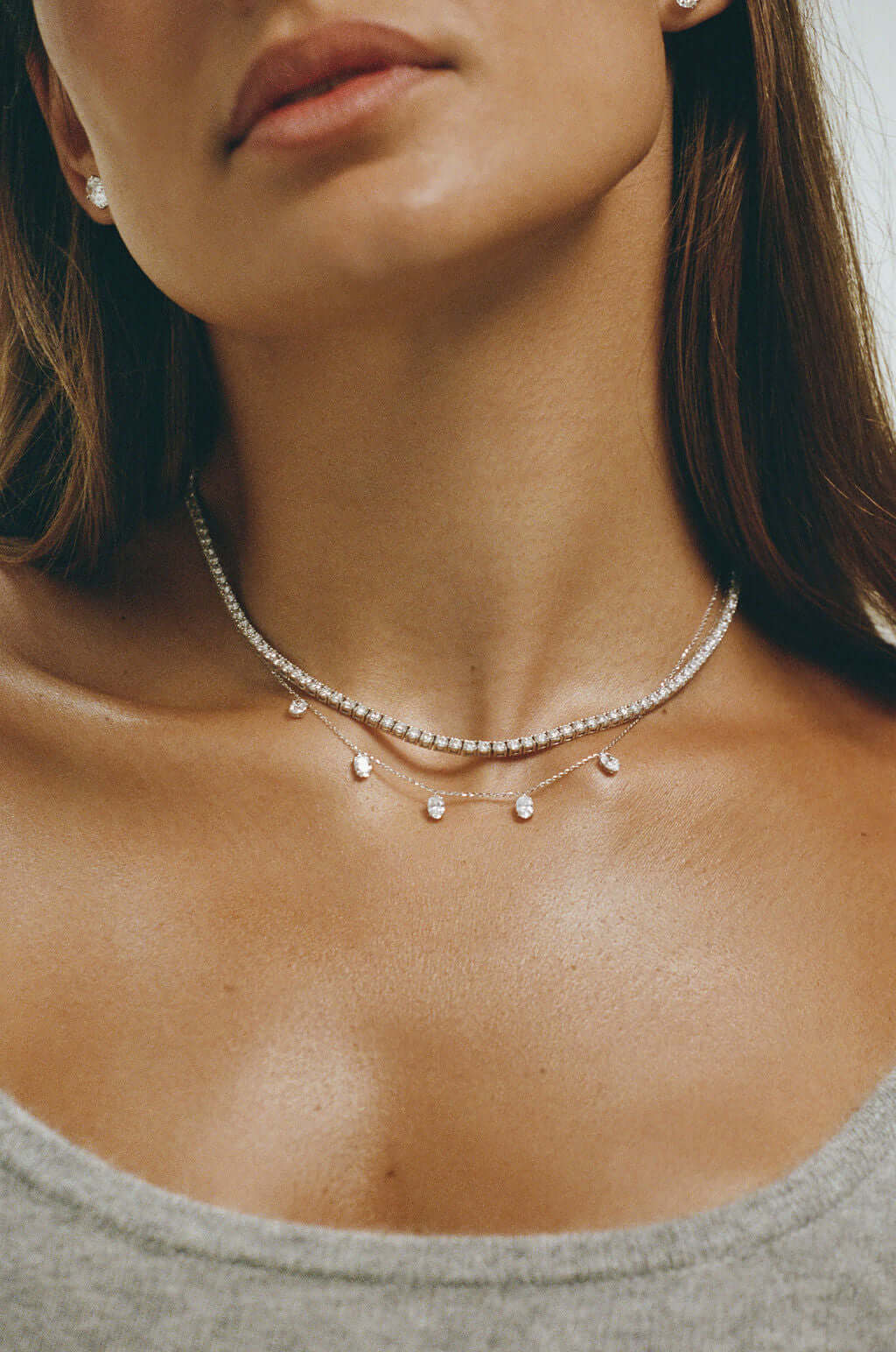 Hanging Oval Diamond Station Necklace 1.6ct Lab Diamond worn by model with elegant neckline.