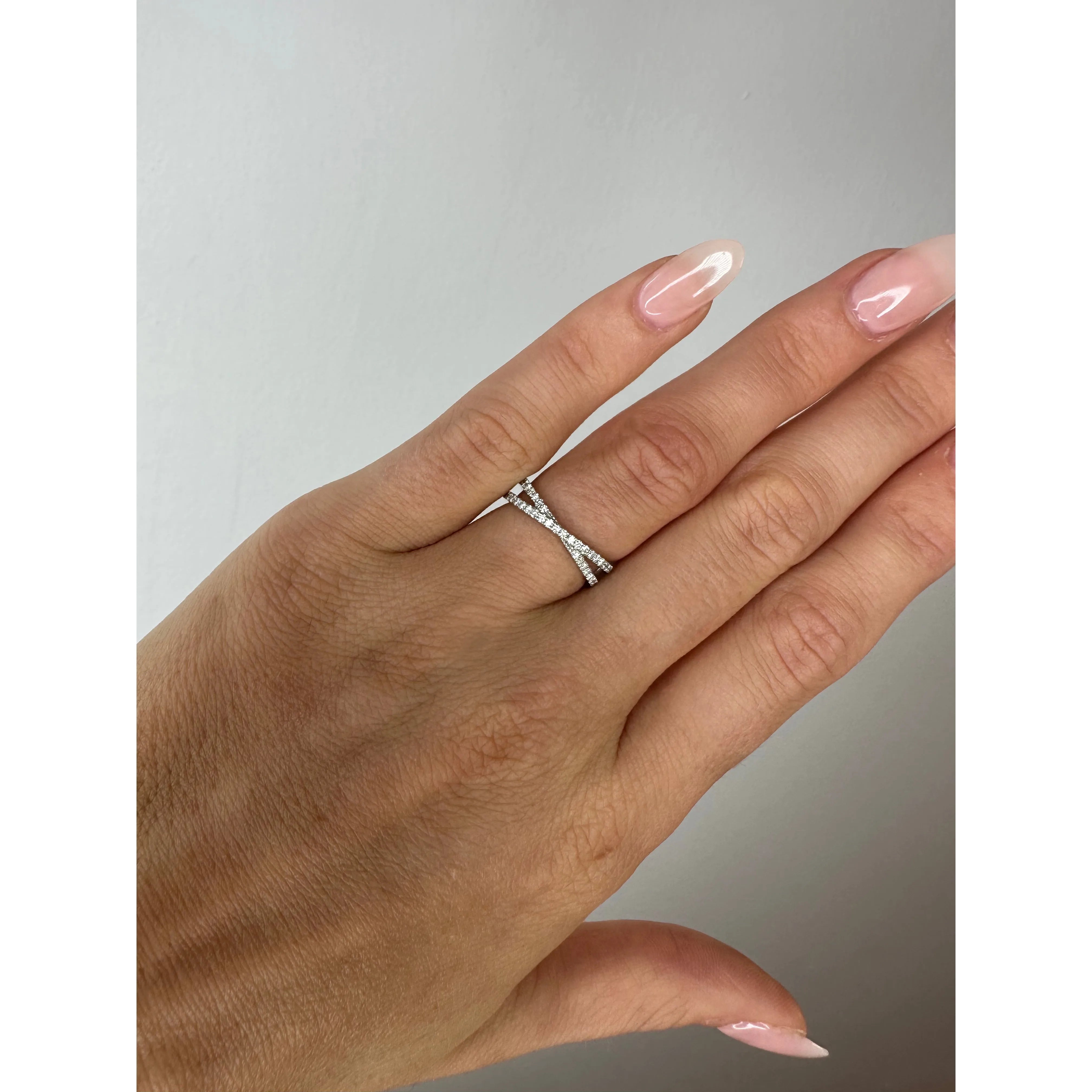 white gold diamond crossover ring