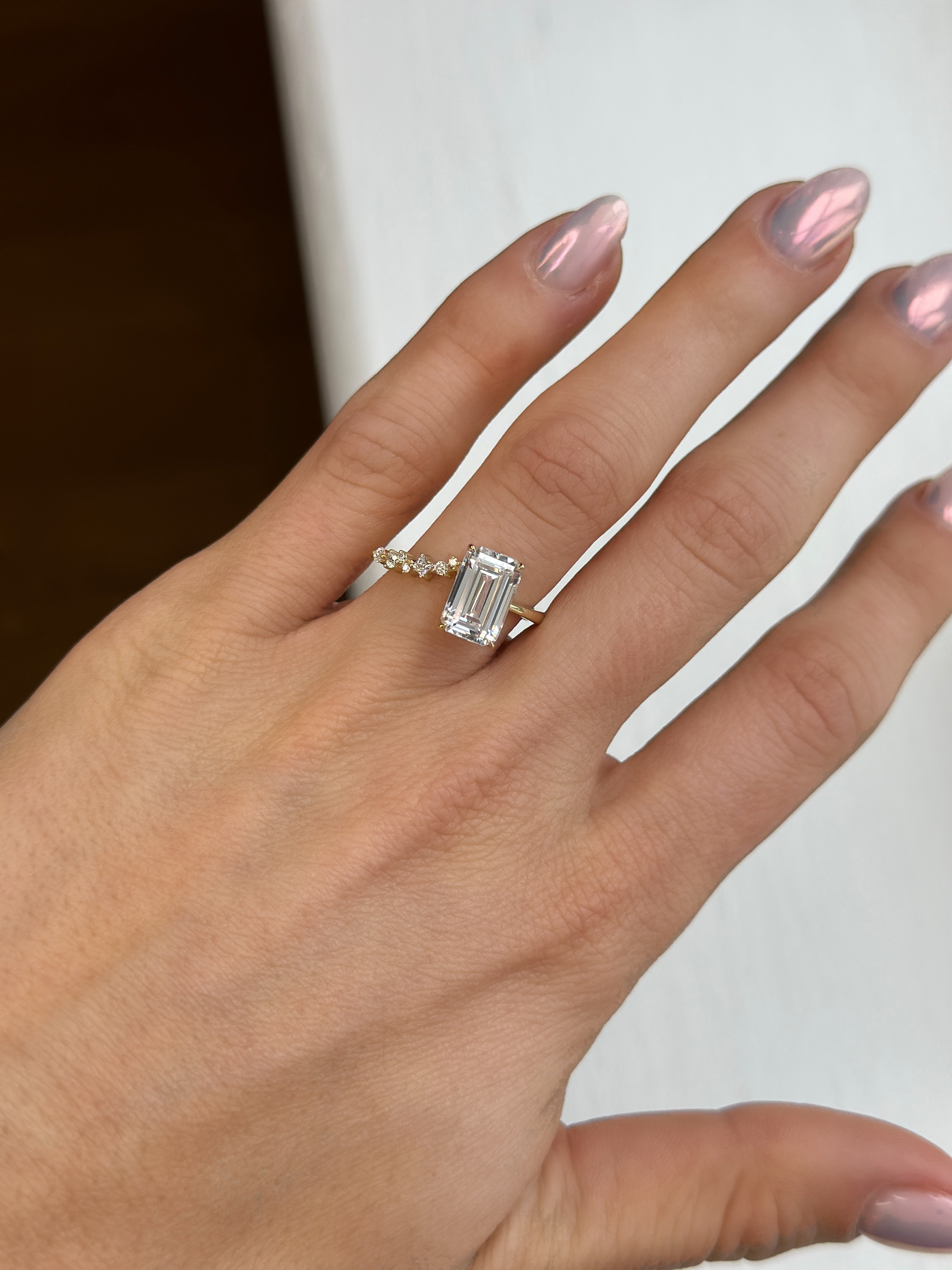 emerald diamond ring on hand