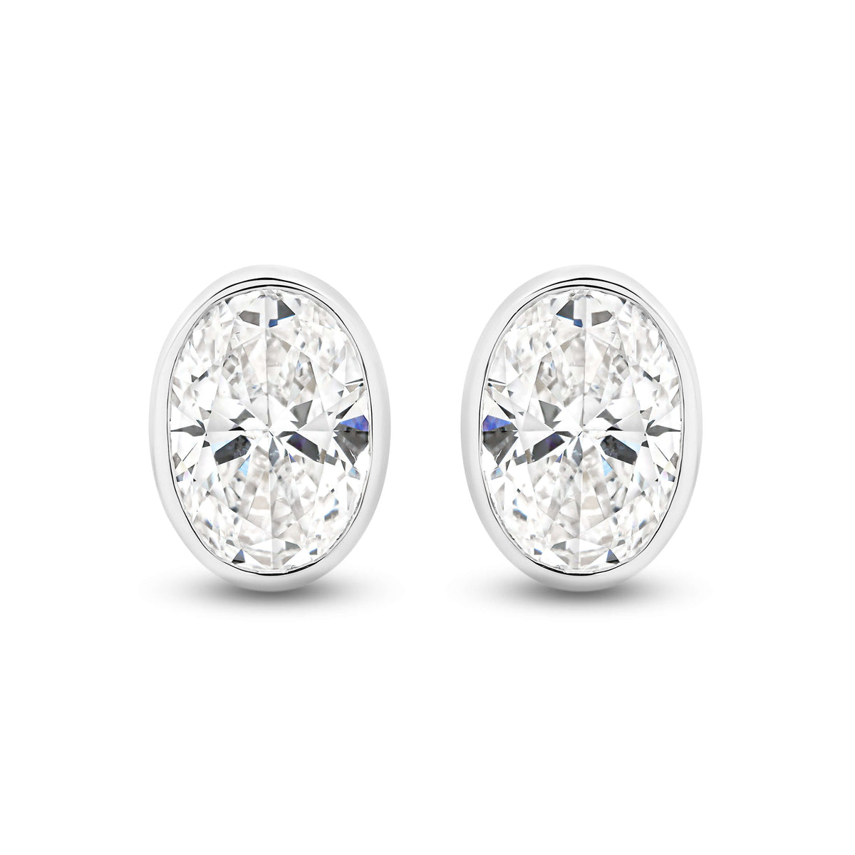 Oval Bezel Stud Earrings Lab Diamond in 9ct white gold featuring F/VS lab diamonds.